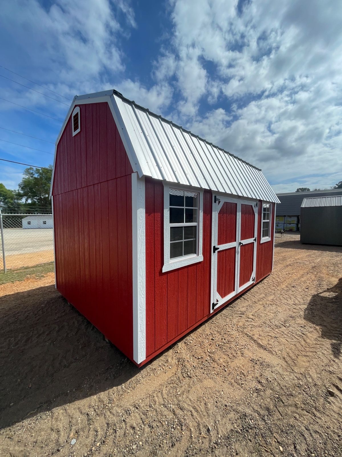 Red side lofted barn shed
